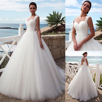 Stunning Tulle Jewel Neckline A-Line Beach Wedding Dress With Beaded Lace Appliques Crystals Belt Bridal Gowns
Stunning Tulle Jewel Neckline A-Line Beach Wedding Dress With Beaded Lace Appliques Crystals Belt Bridal Gowns