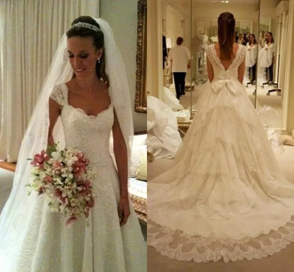 Lace Cap Sleeve Tiered Ruffle A Line Wedding Dresses Sweep Train With Big Bow Belt Backless Bridal Gowns plus size wedding gowns
Lace Cap Sleeve Tiered Ruffle A Line Wedding Dresses Sweep Train With Big Bow Belt Backless Bridal Gowns plus size wedding gowns