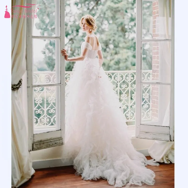 2019 Off-the-Shoulder V Neck A-line Floor-length With Ruffles Court Train Simple Backless Wedding Dresses Vestido de Noiva JQ576
2019 Off-the-Shoulder V Neck A-line Floor-length With Ruffles Court Train Simple Backless Wedding Dresses Vestido de Noiva JQ576