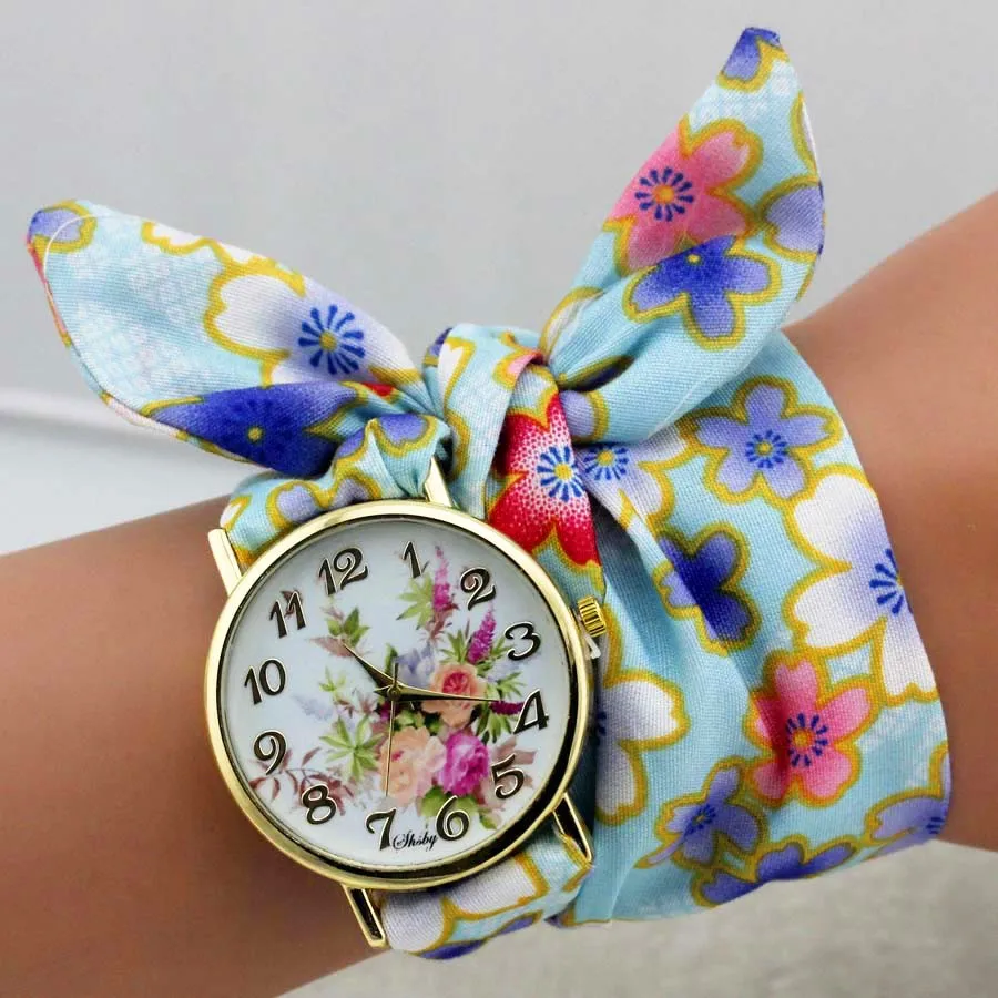 Женские наручные часы shsby дизайнерские золотистые тканевые с цветком под платье