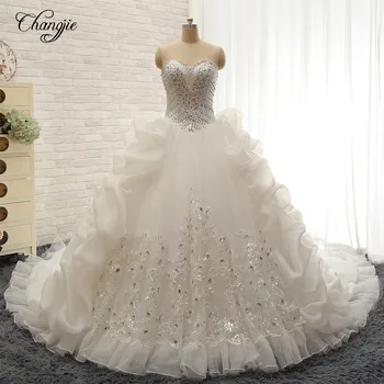 New Amazing Long Wedding Dress 2018 Sweetheart Zipper Back Ball Gown Chapel Train Beading Crystal Organza Bride Dresses Vestidos 
New Amazing Long Wedding Dress 2018 Sweetheart Zipper Back Ball Gown Chapel Train Beading Crystal Organza Bride Dresses Vestidos
