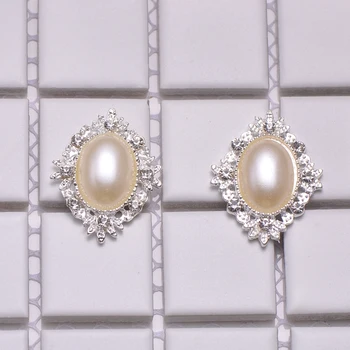 (M1035) 100pcs/lot,25mmx32mm rhinestone embellishment, silver plating,ivory or pure white pearl
(M1035) 100pcs/lot,25mmx32mm rhinestone embellishment, silver plating,ivory or pure white pearl