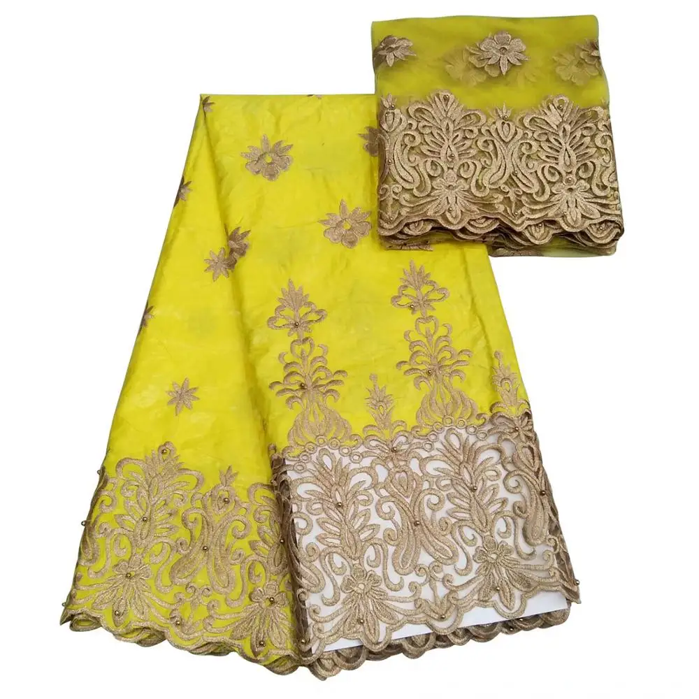 African yellow bazin riche getzner with net lace and french lace high quality available in blue black orange african fabric
African yellow bazin riche getzner with net lace and french lace high quality available in blue black orange african fabric