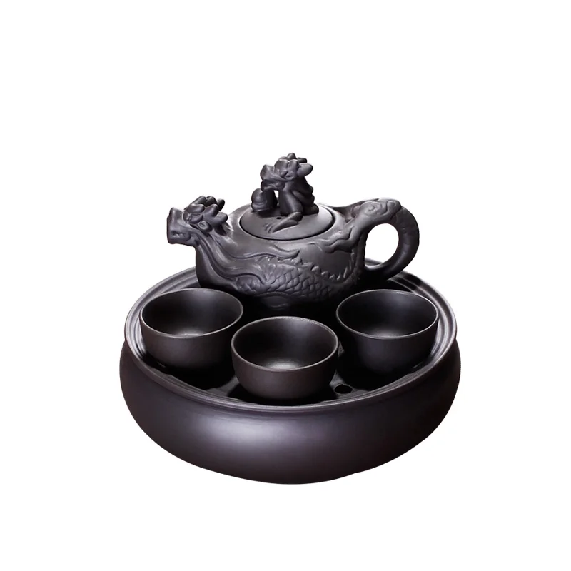 Zisha pot Kung Fu tea set complete set of small household teapot round tea tray set tea cup office
Zisha pot Kung Fu tea set complete set of small household teapot round tea tray set tea cup office