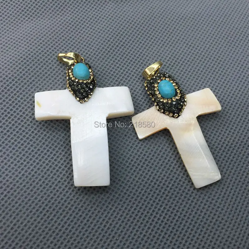 M51127414 Shell Cross Pendant Shell Cross Charm with CZ Pave Cap and Howlite Beads Accent
M51127414 Shell Cross Pendant Shell Cross Charm with CZ Pave Cap and Howlite Beads Accent