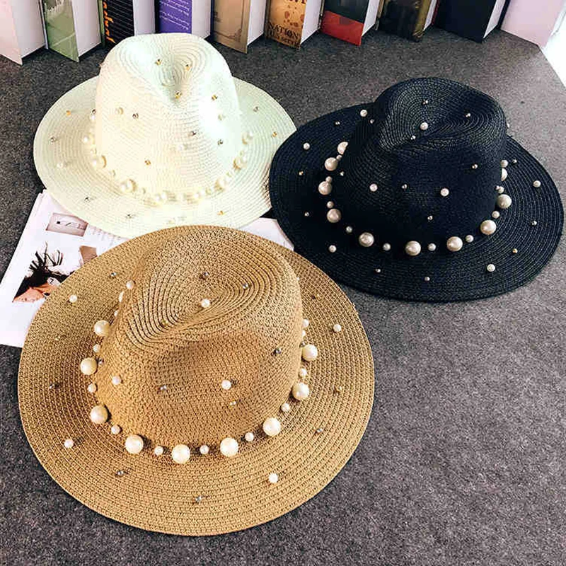 2019 New Summer British pearl beading flat brimmed straw hat Shading sun hat Lady beach hat Sunscreen fashion jazz cap
2019 New Summer British pearl beading flat brimmed straw hat Shading sun hat Lady beach hat Sunscreen fashion jazz cap
