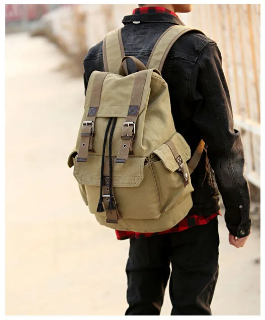 a guy with a beige carrying a vintage backpack on his shoulders