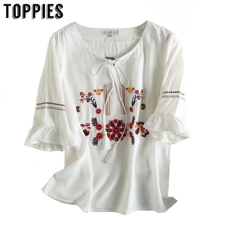 White Embroidered Shirt Flare Sleeve Boho Tops Lace Up Neck 2019 Summer Tassel Tops Women Streetwear AP176
White Embroidered Shirt Flare Sleeve Boho Tops Lace Up Neck 2019 Summer Tassel Tops Women Streetwear AP176