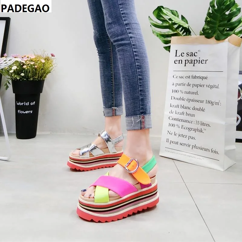 European station summer new fluorescent color matching color striped thick bottom muffin open toe sandals Roman women's shoes
European station summer new fluorescent color matching color striped thick bottom muffin open toe sandals Roman women's shoes
