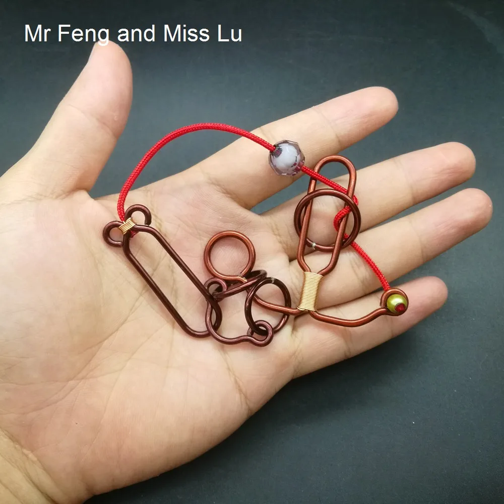 Sailboat Shape Hand Made Wire Puzzle Red Copper Ring Puzzle Solution Hobby Collectibles Toy
Sailboat Shape Hand Made Wire Puzzle Red Copper Ring Puzzle Solution Hobby Collectibles Toy