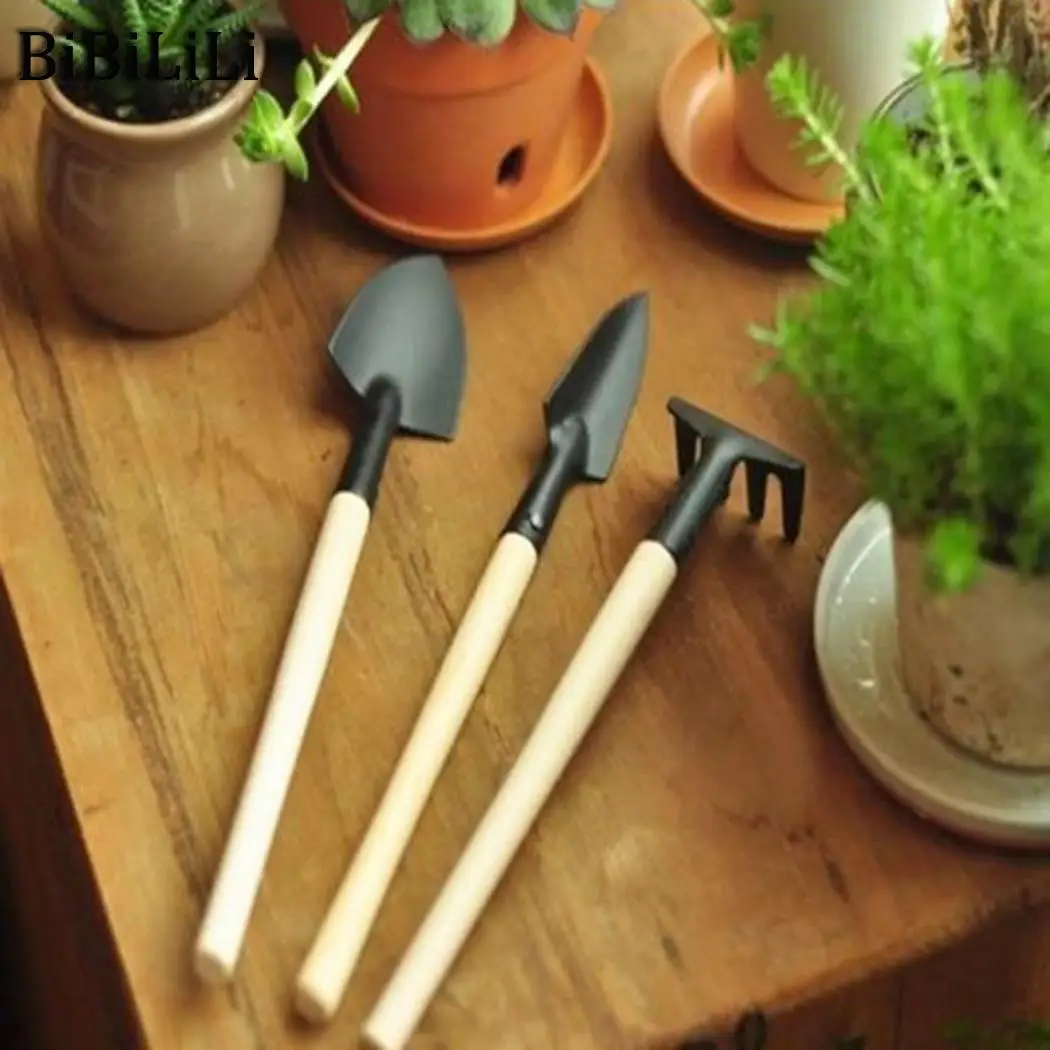 Set Handle sturdy Plant Tools Outdoor gardening Mini Iron Rake Garden tool Black durable Excavator Wooden Spade hand Tools 
Set Handle sturdy Plant Tools Outdoor gardening Mini Iron Rake Garden tool Black durable Excavator Wooden Spade hand Tools