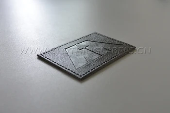 Customized embossed printed PU Leather Label badge patch for Jeans, PU leather label with stitching
Customized embossed printed PU Leather Label badge patch for Jeans, PU leather label with stitching