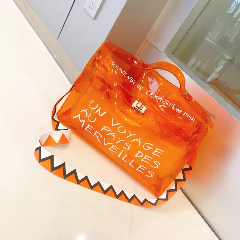 Ladies Transparent Jelly Bag Letter Printing Big Orange Clear Tote Bag Women Large Capacity Beach Handbag Sac Femm Wavy Strap
Ladies Transparent Jelly Bag Letter Printing Big Orange Clear Tote Bag Women Large Capacity Beach Handbag Sac Femm Wavy Strap