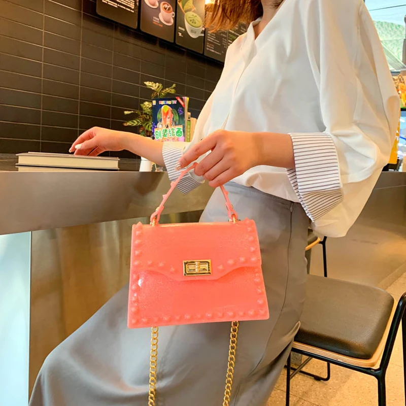 Women Shine PVC Transparent Jelly Bag Designer Rivet Tote Ladies Handbags Brand Luxury Beach Shoulder Bags Chain Messenger Bags
Women Shine PVC Transparent Jelly Bag Designer Rivet Tote Ladies Handbags Brand Luxury Beach Shoulder Bags Chain Messenger Bags