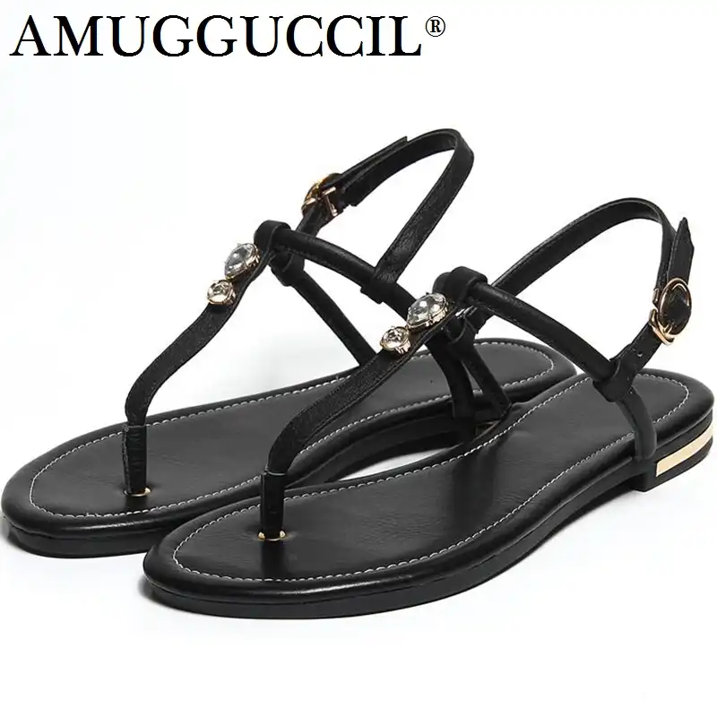 black sandals with gold buckle