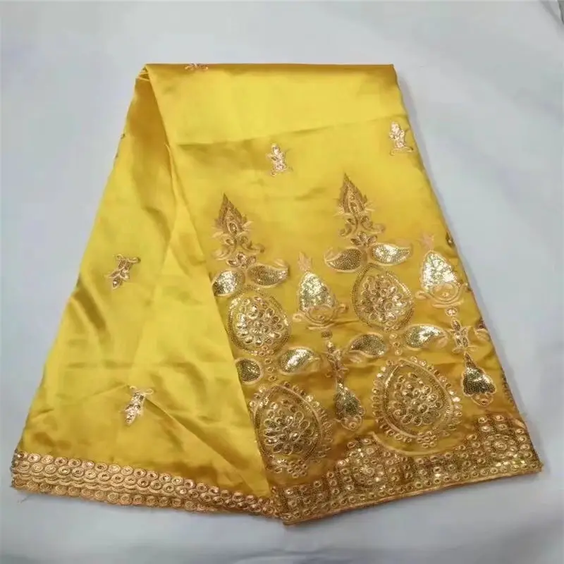 Nigerian raw silk George wrappers with Stones African George Fabric with gold embroidery High Quality African George wrapper
Nigerian raw silk George wrappers with Stones African George Fabric with gold embroidery High Quality African George wrapper
