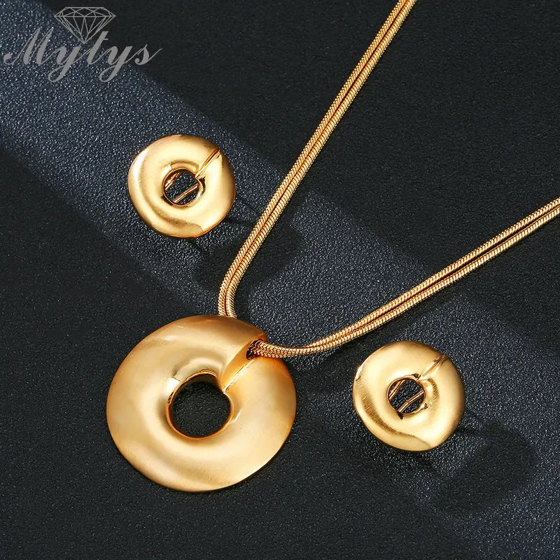 Mytys Yellow Gold Color Round Pendant Necklace and Earrings Sets Jewelry for Women Trendy Jewelry sets New Fashion CN353
Mytys Yellow Gold Color Round Pendant Necklace and Earrings Sets Jewelry for Women Trendy Jewelry sets New Fashion CN353