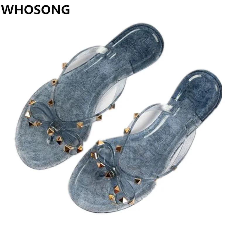 Summer rivet flip-flops glitter sequin bow beach slippers pin toe flat jelly sandals slippers
Summer rivet flip-flops glitter sequin bow beach slippers pin toe flat jelly sandals slippers