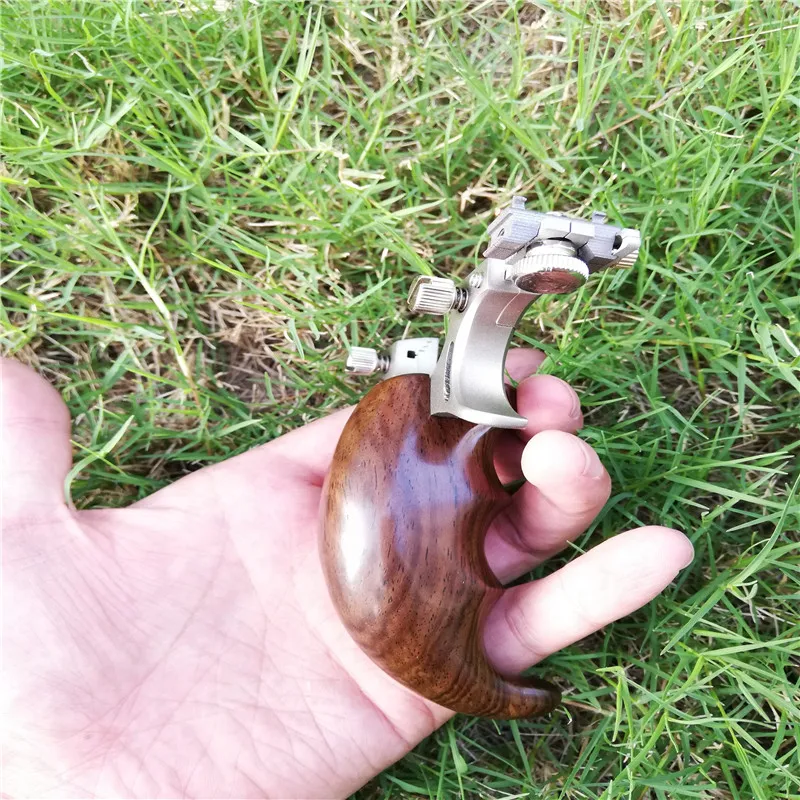 Slingshot Hunting Catapult 304 Stainless steel with Wooden Handle Slingshot Flat Rubber band Tubing Outdoor Shooting Slingshots
Slingshot Hunting Catapult 304 Stainless steel with Wooden Handle Slingshot Flat Rubber band Tubing Outdoor Shooting Slingshots