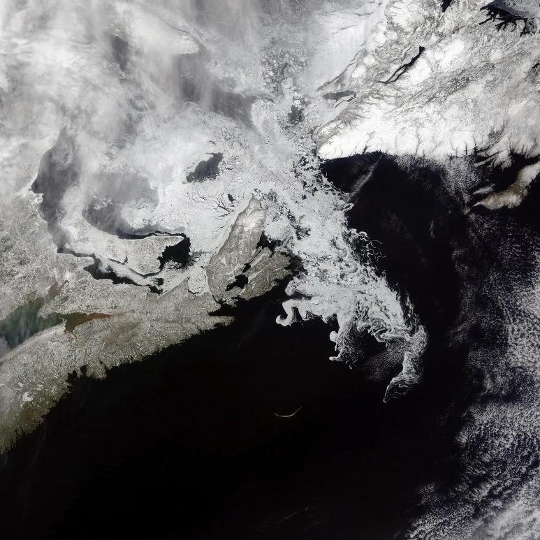Sea ice fills the Gulf of St. Lawrence giving the landscape a wintery appearance Poster Print (16 x 12)