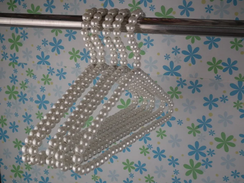 ABS imitation pearl hangers Factory direct sale KIDS coats or skirts display white plastic beads hanger
ABS imitation pearl hangers Factory direct sale KIDS coats or skirts display white plastic beads hanger