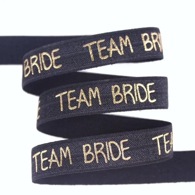 2 colors 5/8" (15mm) gold foil TEAM BRIDE printed fold over elastic for wedding accessaries
2 colors 5/8" (15mm) gold foil TEAM BRIDE printed fold over elastic for wedding accessaries