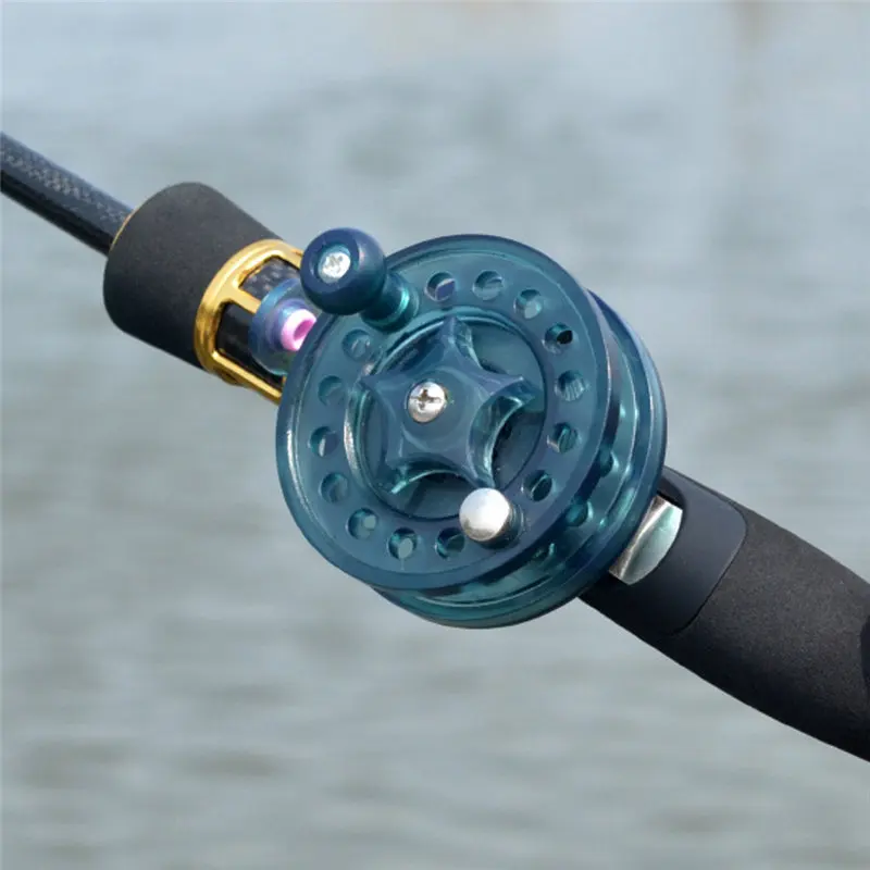 Фото Рыболовная катушка для ловли нахлыстом диаметр 60 мм бесцветная белая/черная