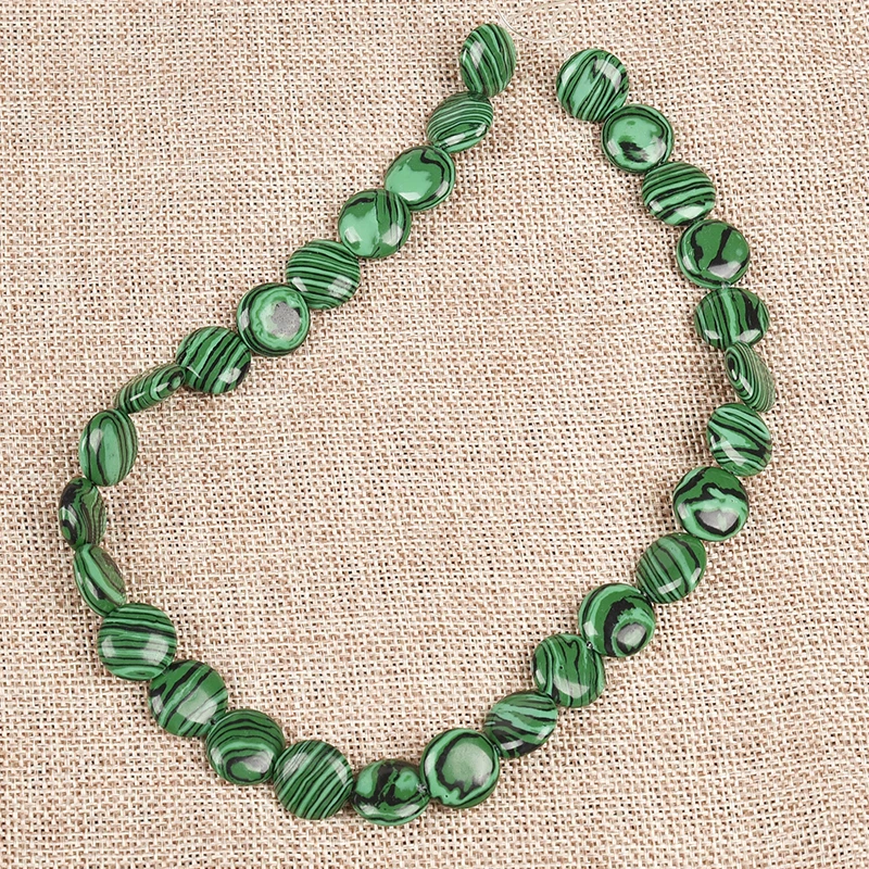 Flat round ball with smooth lines 14*5 MM Syn-thetic Hard and beautiful green Syn-thesis Malachite Loose beads
Flat round ball with smooth lines 14*5 MM Syn-thetic Hard and beautiful green Syn-thesis Malachite Loose beads