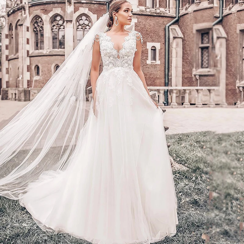 Bohemian Wedding Dress 2019 Sleeveless V-Neck Lace Open Back Unique Pearls Beading Romantic Backless Boho Beach Bridal Gowns
Bohemian Wedding Dress 2019 Sleeveless V-Neck Lace Open Back Unique Pearls Beading Romantic Backless Boho Beach Bridal Gowns