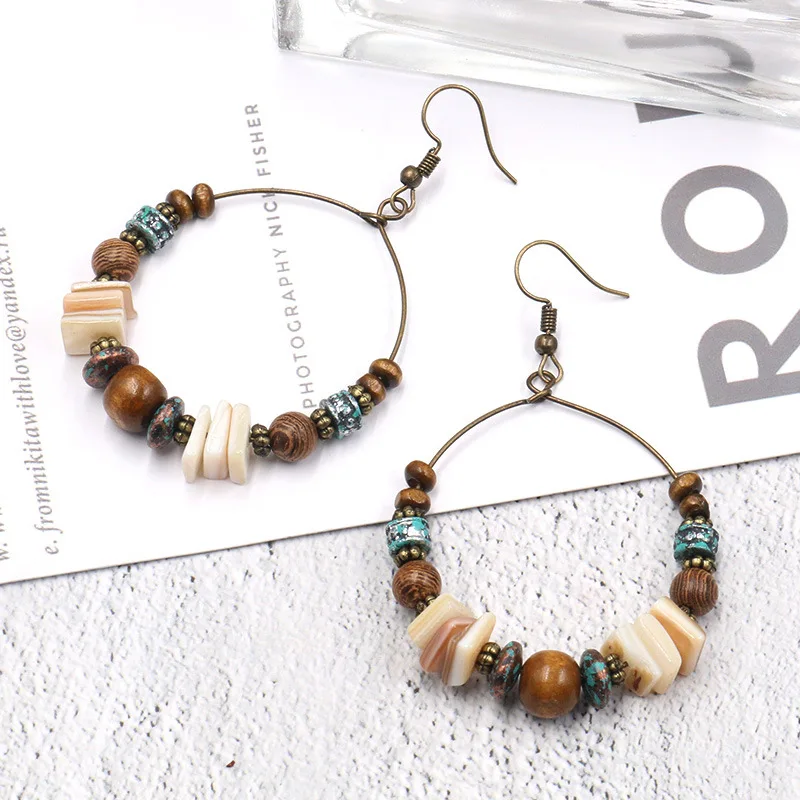 Fashion retro bohemian beach wind handmade beaded natural shell wood beads big circle environmental alloy woman earrings
Fashion retro bohemian beach wind handmade beaded natural shell wood beads big circle environmental alloy woman earrings