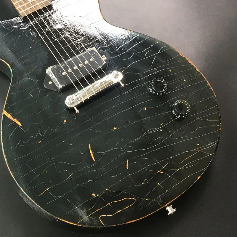 New black paint electric guitar, retro old, hand carved old, provide guitar icon, customizable electric guitar, including shippi
New black paint electric guitar, retro old, hand carved old, provide guitar icon, customizable electric guitar, including shippi