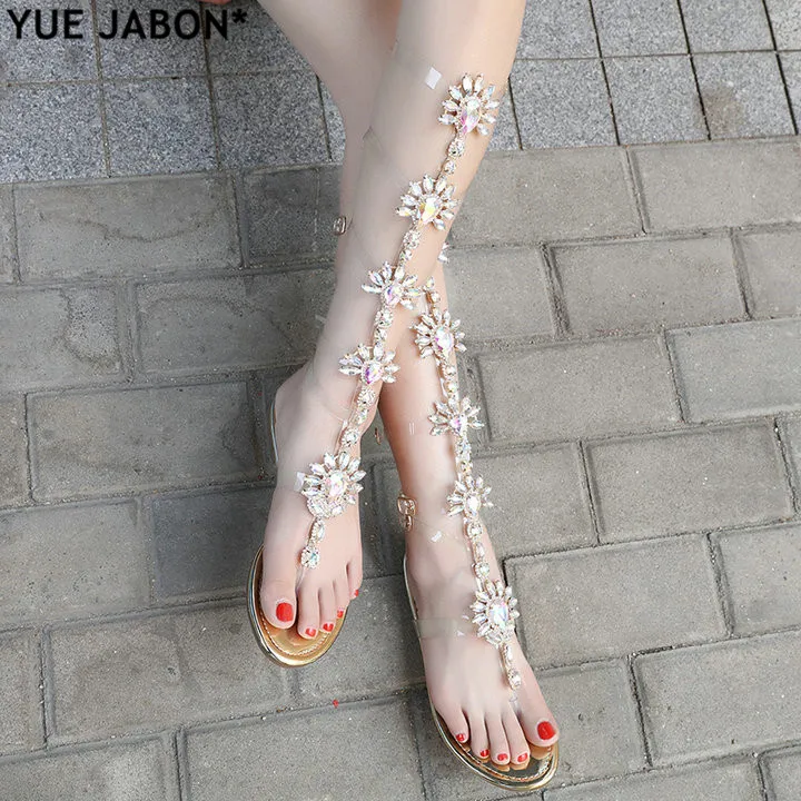 YUE JABON Sexy Woman Summer Flat Sandals Gladiator Gold Rhinestone Knee High shoes Bohemia Style Crystal Beach Shoes Big size 43
YUE JABON Sexy Woman Summer Flat Sandals Gladiator Gold Rhinestone Knee High shoes Bohemia Style Crystal Beach Shoes Big size 43