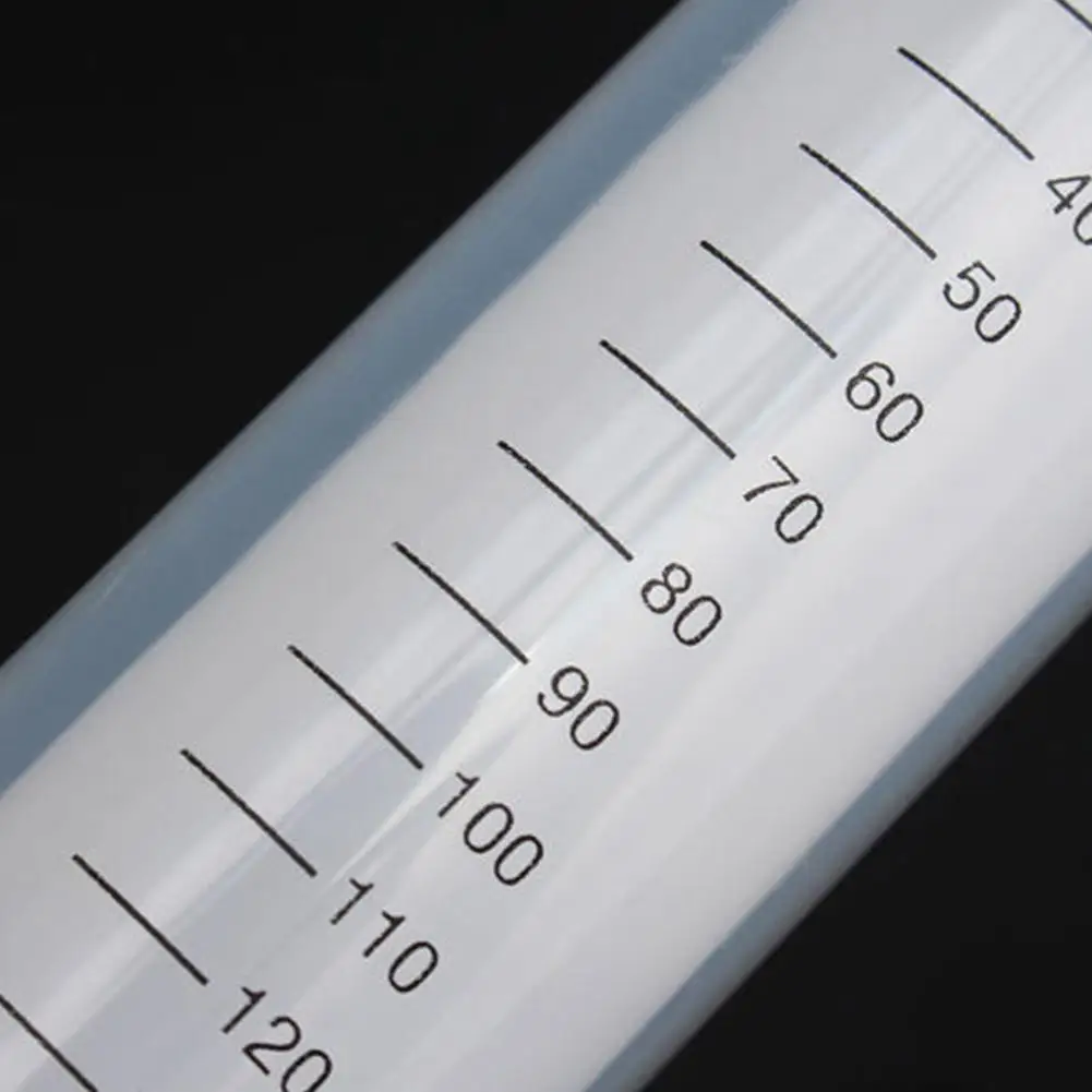 Close-up of a reusable plastic syringe with clear markings