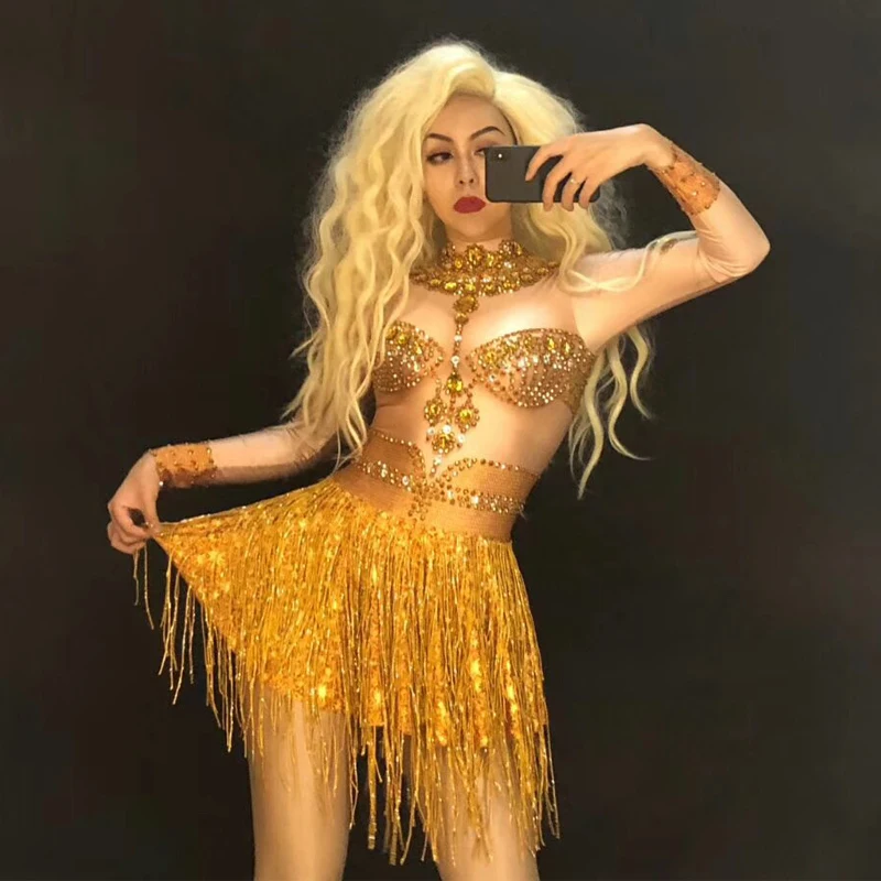 Jazz Dance Costume Golden Tassel Rhinestone Bodysuit DJ Stage Wear Sexy Singer Outfits For Women Nightclub Performance DNV10530
Jazz Dance Costume Golden Tassel Rhinestone Bodysuit DJ Stage Wear Sexy Singer Outfits For Women Nightclub Performance DNV10530