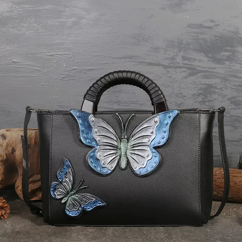 Quality Designer Handmade Blue Butterfly Handbag Women First Layer Genuine Leather Tote Handle Bag with Wooden Handle
Quality Designer Handmade Blue Butterfly Handbag Women First Layer Genuine Leather Tote Handle Bag with Wooden Handle