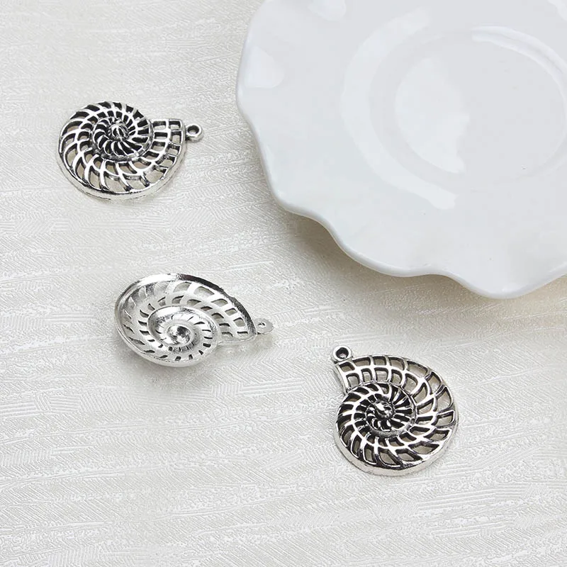 10 pcs/lot 27*35mm Charm Alloy Ornament Cute Small Conch Shaped Pendant Necklace Bracelet Clothing Jewelry Pendant
10 pcs/lot 27*35mm Charm Alloy Ornament Cute Small Conch Shaped Pendant Necklace Bracelet Clothing Jewelry Pendant