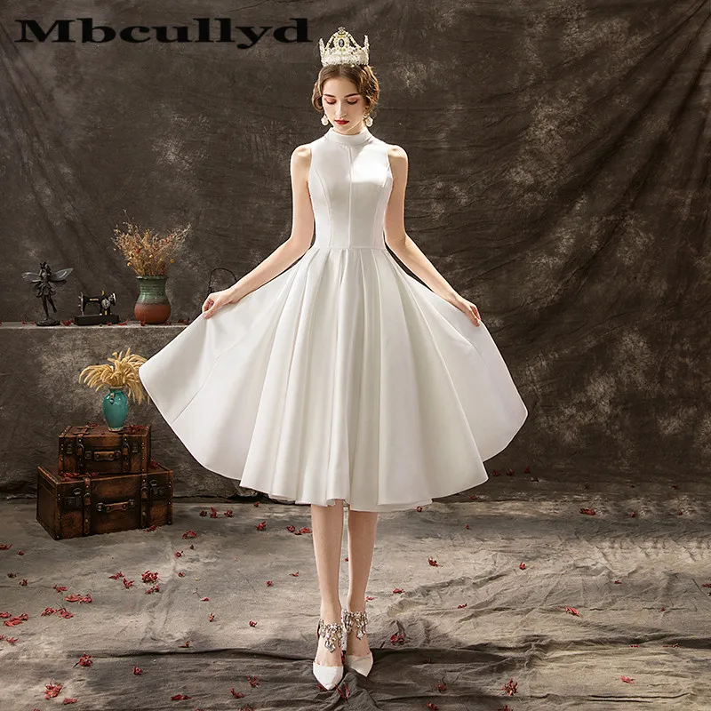 Mbcullyd Sheer Backless Beach Wedding Dresses Vintage High Neck Country 1950s Bridal Gowns Sexy Knee Length Vestidos de novia
Mbcullyd Sheer Backless Beach Wedding Dresses Vintage High Neck Country 1950s Bridal Gowns Sexy Knee Length Vestidos de novia