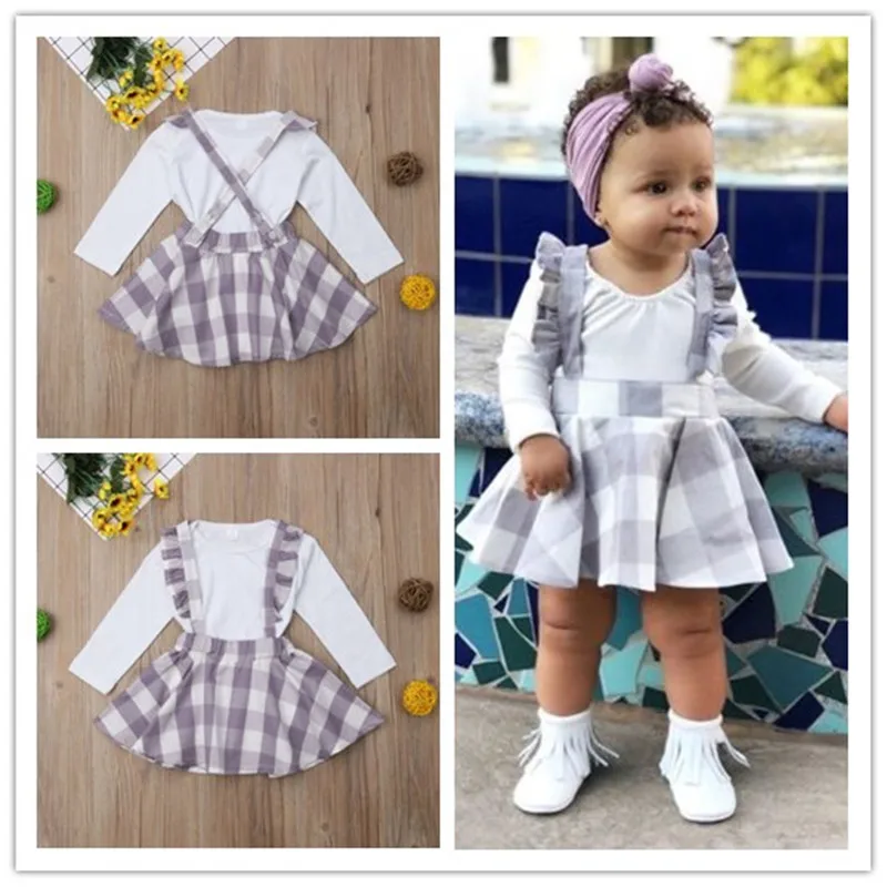 Newborn Kids Baby Girls clothes Plaid strap Ruffle Skirts round neck long sleeve solid Bodysuit 2pc Toddler lovely Outfits
Newborn Kids Baby Girls clothes Plaid strap Ruffle Skirts round neck long sleeve solid Bodysuit 2pc Toddler lovely Outfits