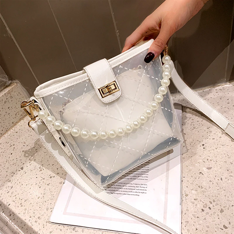 Clear Transparent jelly wrapped pearl lady bag new high-quality PVC lady's wear designer handbag pearl single shoulder inclined
Clear Transparent jelly wrapped pearl lady bag new high-quality PVC lady's wear designer handbag pearl single shoulder inclined