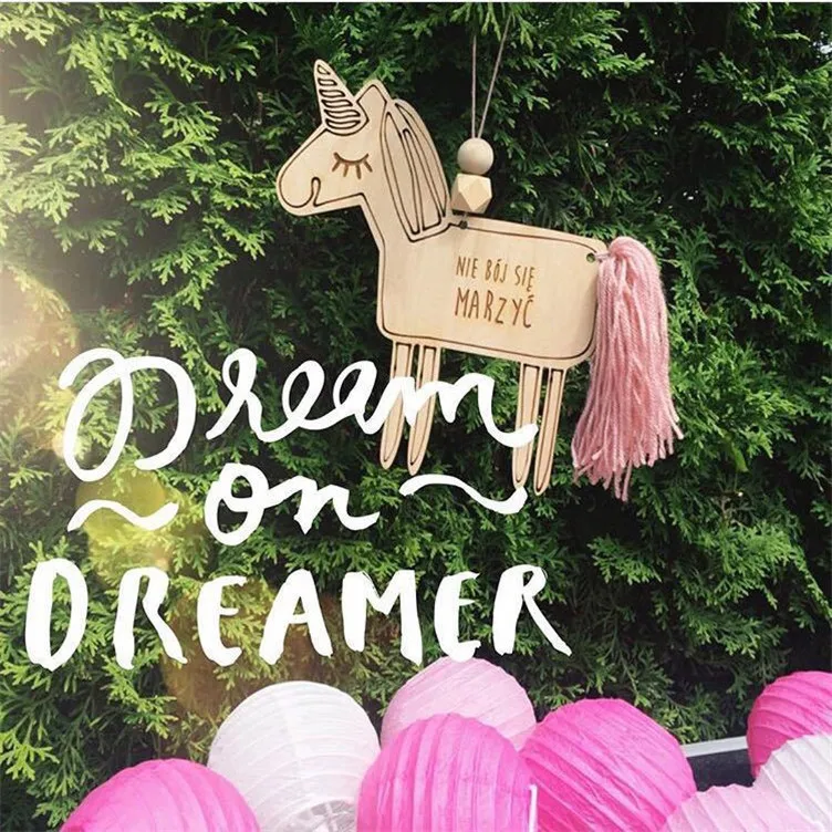 Lovely unicorns with tassels hanging from the fringe of a string of strings wall is decorated with wooden products.
Lovely unicorns with tassels hanging from the fringe of a string of strings wall is decorated with wooden products.