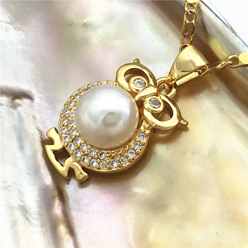 Lady's 5 colors new white/black/purple/grey/pink 14mm natural freshwater pearls 18kgp inlay zircon owl pendant with chain 08
Lady's 5 colors new white/black/purple/grey/pink 14mm natural freshwater pearls 18kgp inlay zircon owl pendant with chain 08