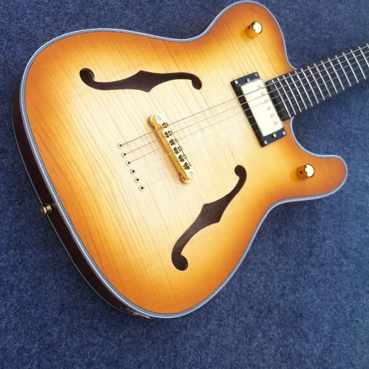 Customized Double F hole TL electric guitar strings thru body gold hardware body binding
Customized Double F hole TL electric guitar strings thru body gold hardware body binding