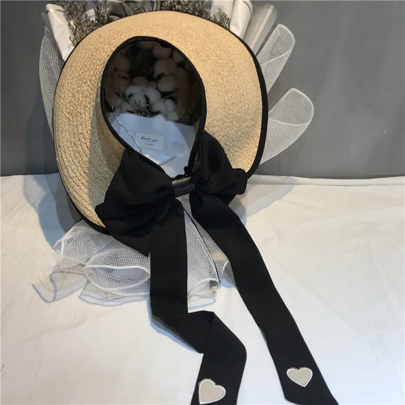 01903-shi summer Natural raffia without wind brim heart Embroidery long ribbon lady bucket cap women leisure hat
01903-shi summer Natural raffia without wind brim heart Embroidery long ribbon lady bucket cap women leisure hat