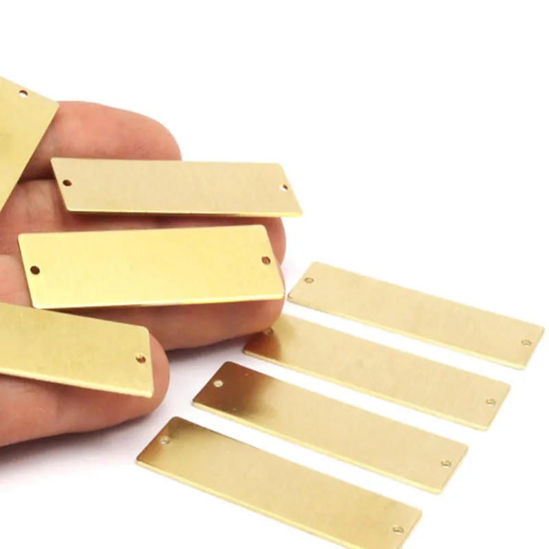 connectors. 10 Raw Brass Rectangle Stamping Blank, 2 Holes Pendant (50x15x0.80mm) A0777
connectors. 10 Raw Brass Rectangle Stamping Blank, 2 Holes Pendant (50x15x0.80mm) A0777