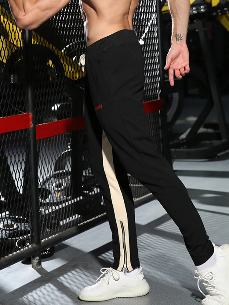 GYMOHYEAH мужские спортивные брюки молния с полосками по бокам буквенным принтом