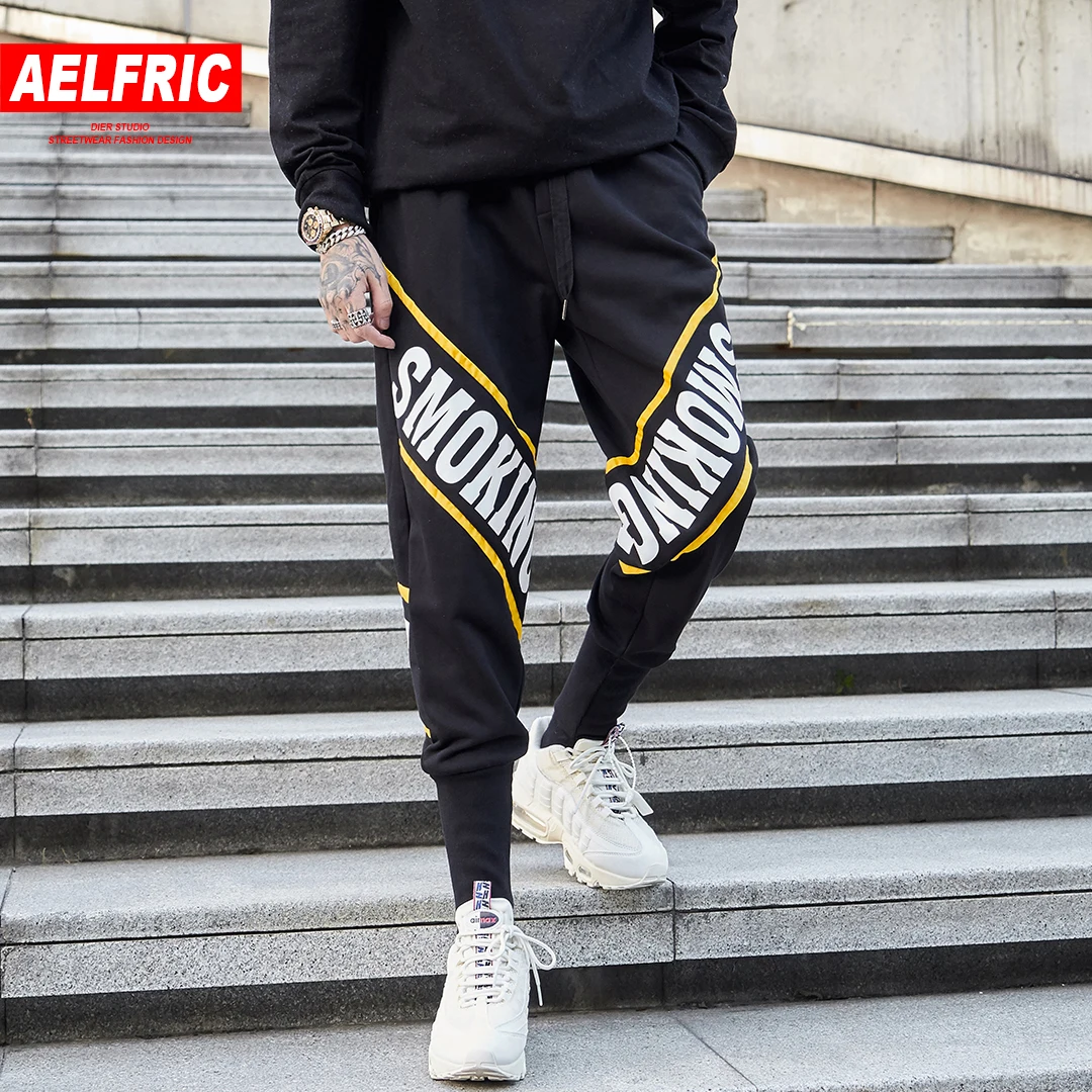 AELFRIC Letter Print Fashion Harajuku Streetwear Casual Pants Men Cotton Sweatpants Man Hip Hop Jogger Black Track Trousers AP56
AELFRIC Letter Print Fashion Harajuku Streetwear Casual Pants Men Cotton Sweatpants Man Hip Hop Jogger Black Track Trousers AP56