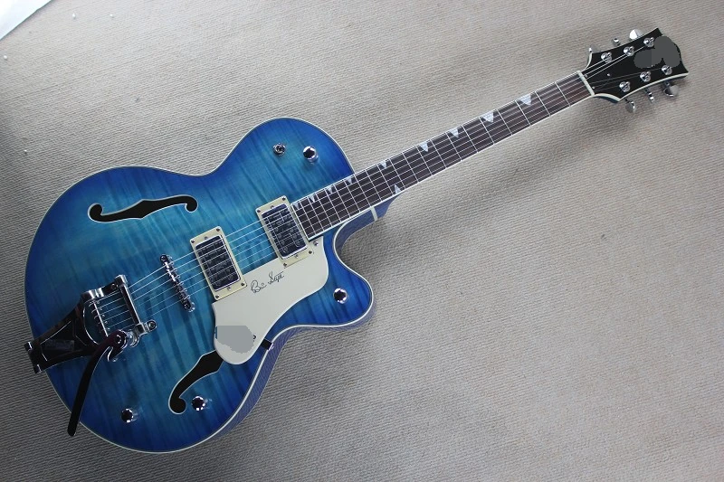Factory custom transparent blue semi-hollow electric guitar with double f holes,flame maple veneer,can be changed
Factory custom transparent blue semi-hollow electric guitar with double f holes,flame maple veneer,can be changed