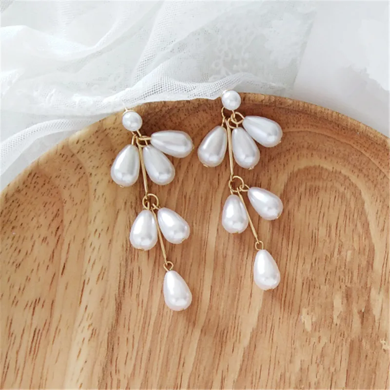 Pearl earring female Fashion simple pearl stud earrings for women Imitation pearl gold long women earrings Jewelry wholesale
Pearl earring female Fashion simple pearl stud earrings for women Imitation pearl gold long women earrings Jewelry wholesale