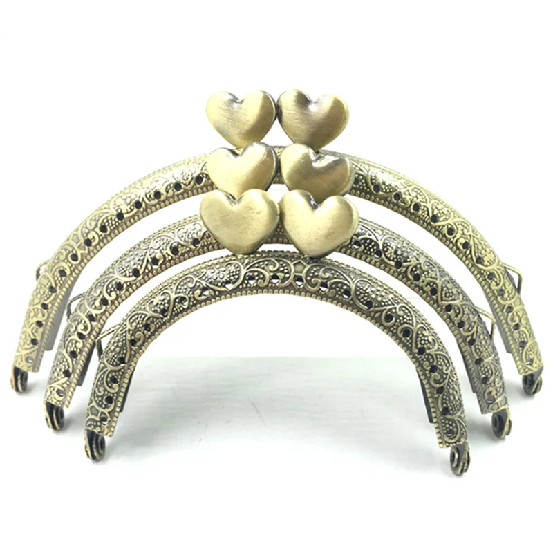 10Pcs Bronze Tone Flower Convex Double Hearts Head Metal Arch Frame Kiss Clasps Lock Purse Bag Handbags Handle Accessories
10Pcs Bronze Tone Flower Convex Double Hearts Head Metal Arch Frame Kiss Clasps Lock Purse Bag Handbags Handle Accessories