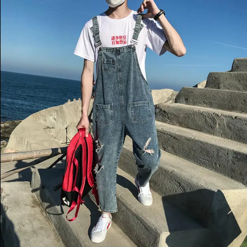 2019 Summer loose student Denim bib pants Men's old hole cowboy nine points suspenders jumpsuit hairstylist tide overalls
2019 Summer loose student Denim bib pants Men's old hole cowboy nine points suspenders jumpsuit hairstylist tide overalls